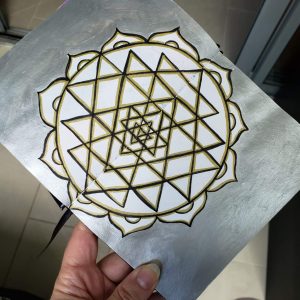 silver and gold painted mandala