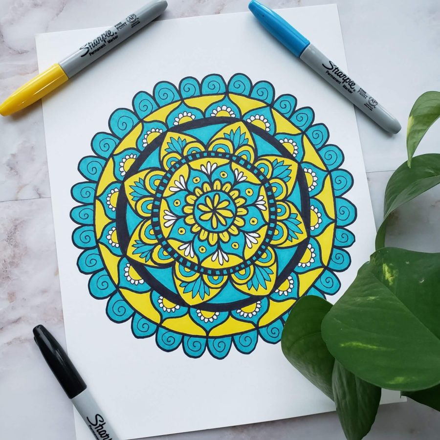therapeutic benefits of drawing mandalas - blue and yellow mandala drawing