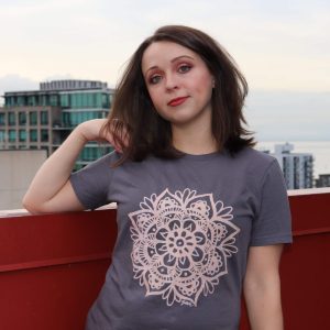 brunette girl wearing mandala shirt