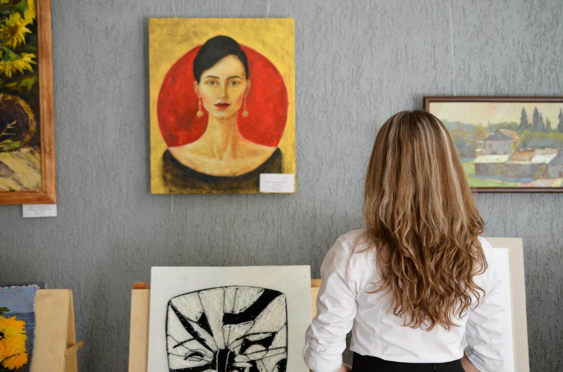 photo of a woman at an art gallery