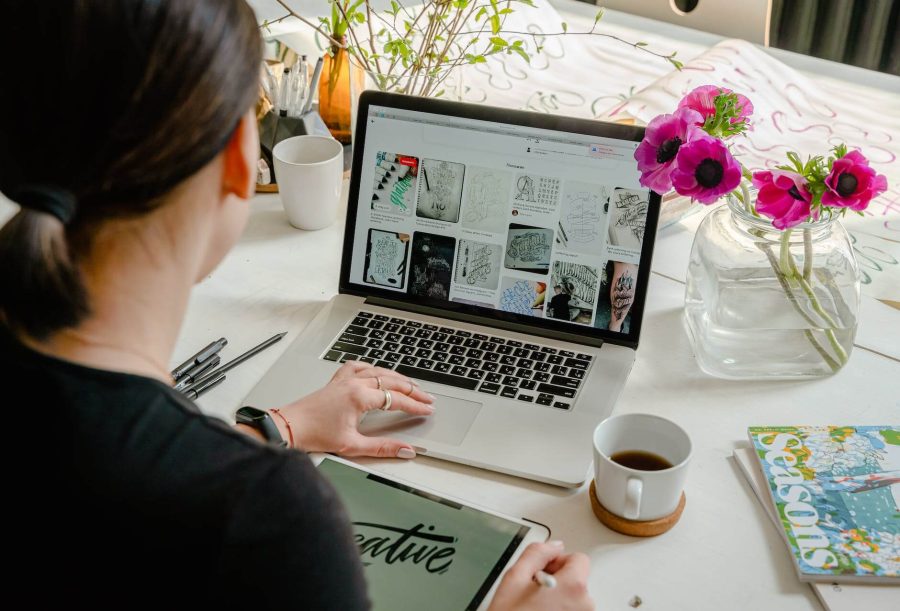 photo of an artist using laptop for graphic designs
