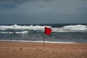 a red flag on the beach