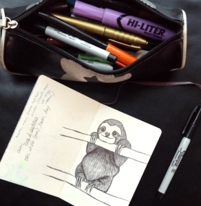 sketchbook drawing of a cute sloth on a branch